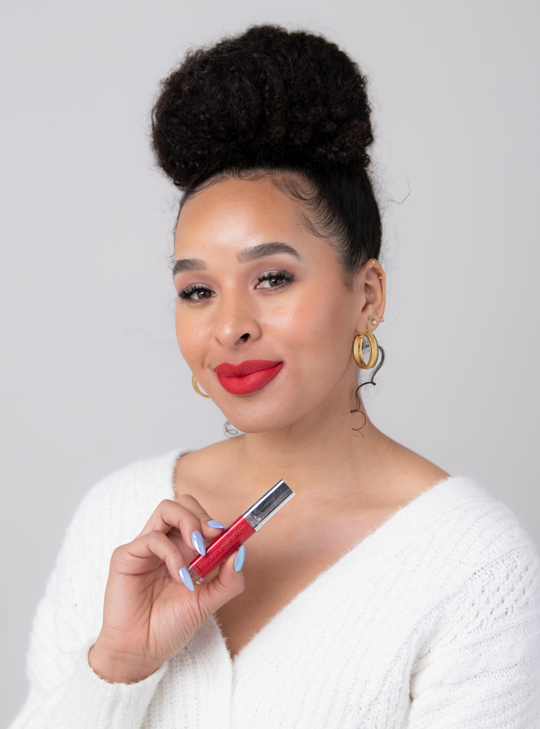 Beautiful black woman wearing a bright red classic lip, Devoted LipLast by Shine Cosmetics